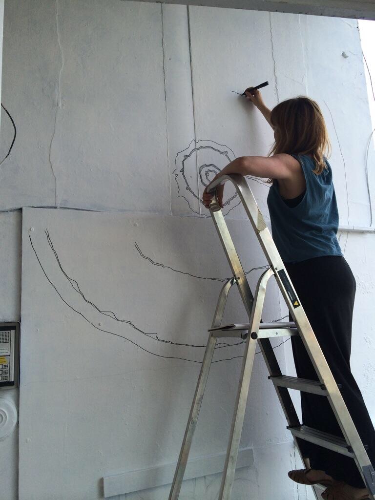 Helen Cann beginning the mural